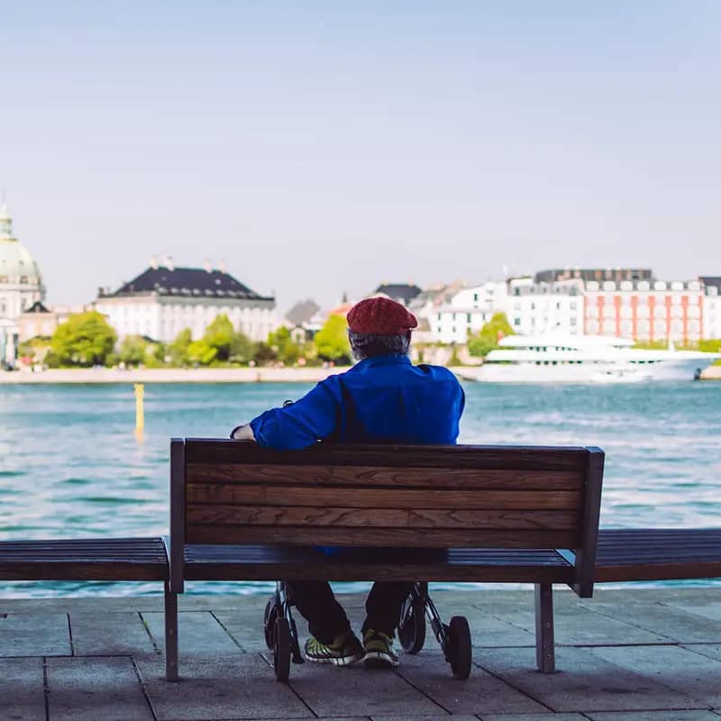 Mand Paa Baenk Koebenhavns Havn Square.webp